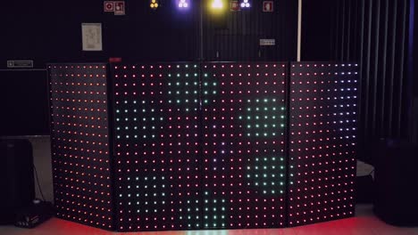 dj booth with vibrant led light panels at a modern party event