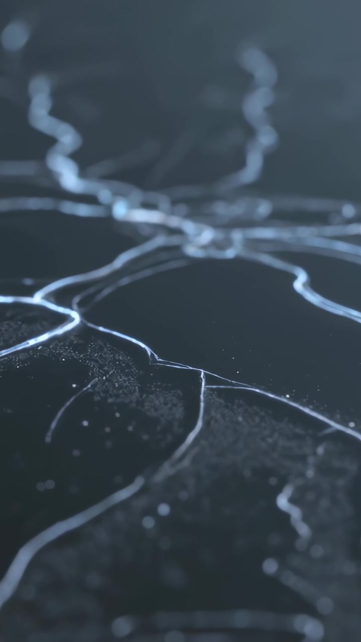 Vertical video: Pulling focus, studio camera revealing dark surface veins and dust, showing texture
