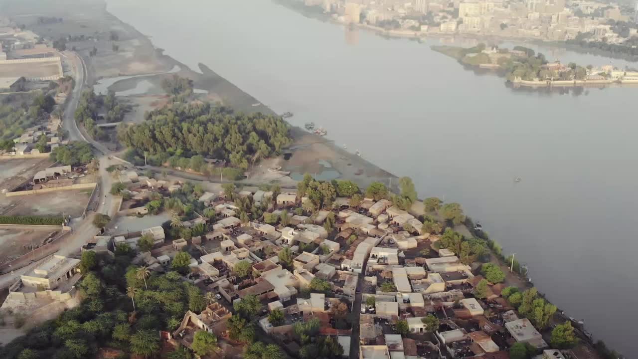 Aerial Pan Up From Sateen Jo Aastan Beside The Indus River In Pakistan.