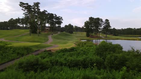 A-Golfer-Hits-His-Ball-And-An-Aerial-Shot-Follows-The-Ball'S-Course-Down-The-Green