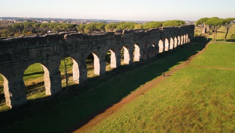 aerial view of claudio aqueduct arches in rome, italy