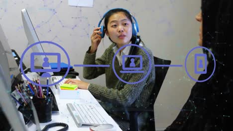 Animation-of-network-of-connections-and-icons-over-asian-businesswoman-in-office
