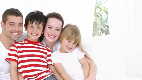 happy family sitting on the couch