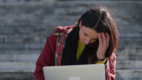 Upset-mature-woman-closing-laptop-and-rubbing-face