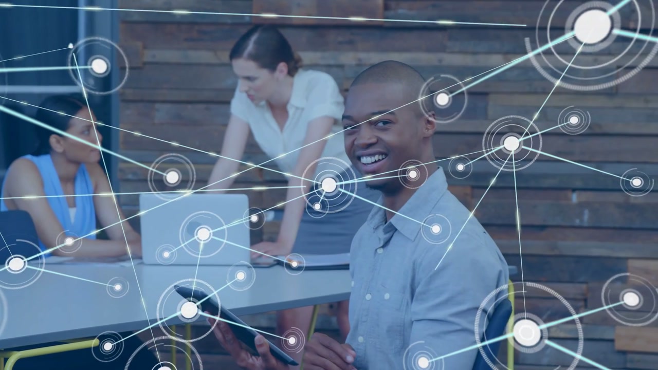 Woman at laptop starting network linking devices, man tapping tablet enabling teamwork in tech
