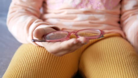 child holding glasses