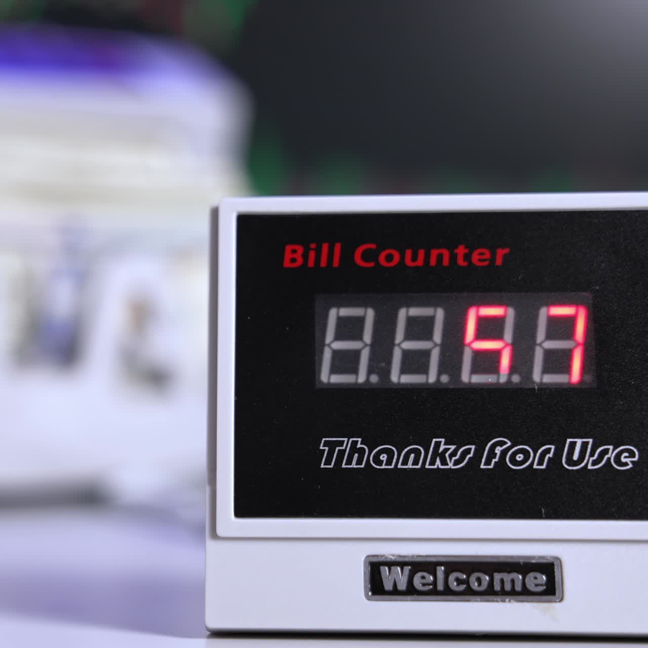 Money counting equipment for paper money calculation. US national paper currency. Automatic mechanism for bank financial operations