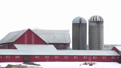 a fan turns on a red barn