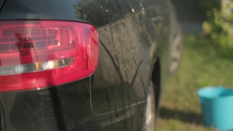 using an electric pressure washer to clean the exterior of a vehicle