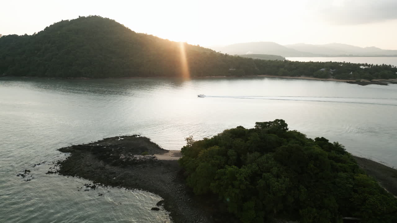 Sunset over a Tropical Bay with a Boat