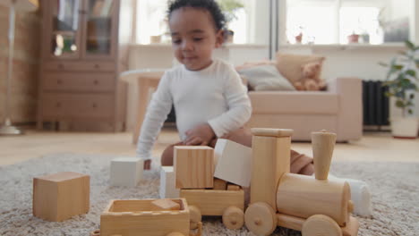 sweet toddler boy playing with toys