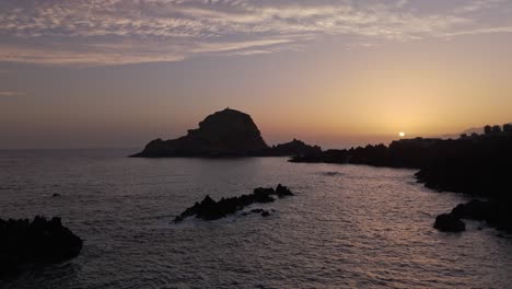 Aerial-of-Madeira-at-sunset-golden-hour-near-Port-Moniz-over-the-Atlantic-ocean