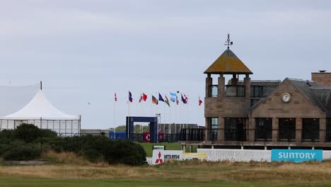 golf event setup with flags and tents