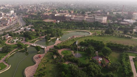 pakistani flag waving in wind. greater iqbal park, lahore pakistan. aerial drone view