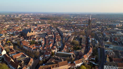 Aerial-view-of-Koppelpoort-is-medieval-gate-in-the-Dutch-city-of-Amersfoort-province-of-Utrecht-completed-around-1425-it-combines-land-and-water-gates-and-is-part-of-the-second-wall-4k-high-resolution