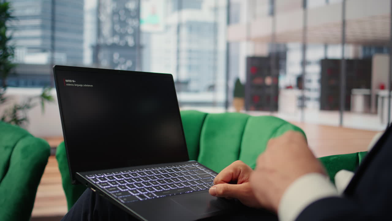 Bucharest, Romania - July 30th 2024 - A businessman relaxing with Netflix