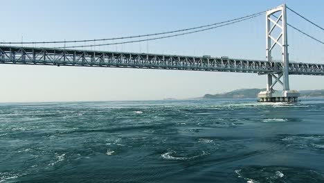 water swirls emerge nsturally underneath the akashi kaikyo bridge