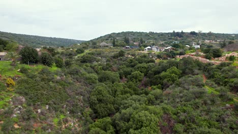 Drone-shot-of-a-canyon-in-the-ecological-community-settlement-Klil