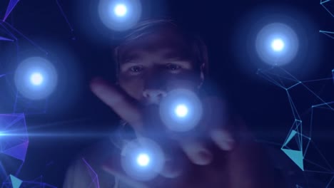 animation of network of connections with blue glowing spots over man using virtual screen