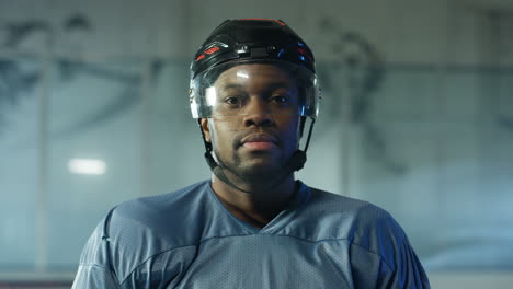 Close-Up-Of-A-Happy-Male-Hockey-Player-Looking-Cheerfully-At-The-Camera-On-The-Ice-Arena-1