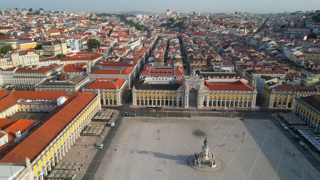 Aerial vew over Praça do Comercio towards Rua Augusta Arch at first hours in the morning with few people at streets.Lisbon,Portugal