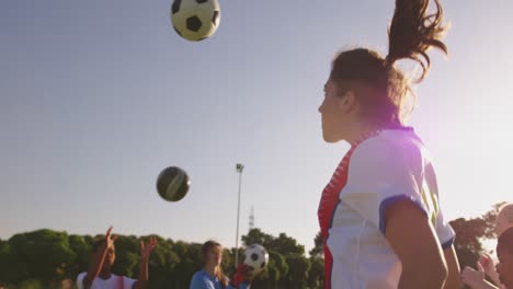 Side-view-of-female-soccer-team-training-4k