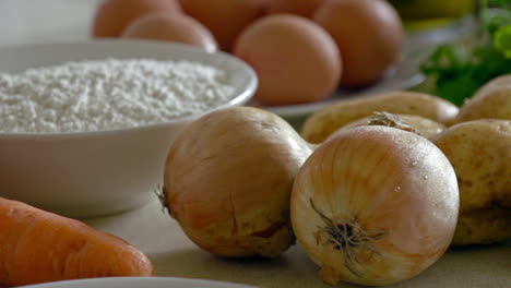 a shot of various ingredients and foods in a kitchen, prepared for cooking