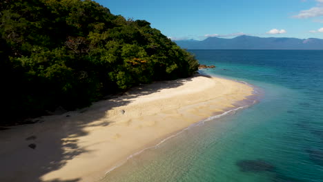 descending drone shot of nudey beach on fitzroy island australia