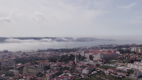 Aerial-circling-shot-of-Ajuda-Palace-with-low-clouds