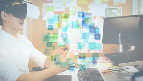 using virtual reality headset, person interacting with digital icons over office workspace