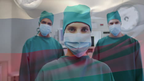 animation of flag of russia over caucasian surgeons with face masks