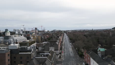 aerial forward view of merrion square park on the south side of dublin city, ireland