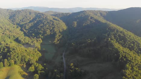 4K-Drone-Video-Flying-High-Above-Trees-in-Smoky-Mountains-near-Appalachian-Trail-along-North-Carolina-and-Tennessee-Border-on-Foggy-Morning