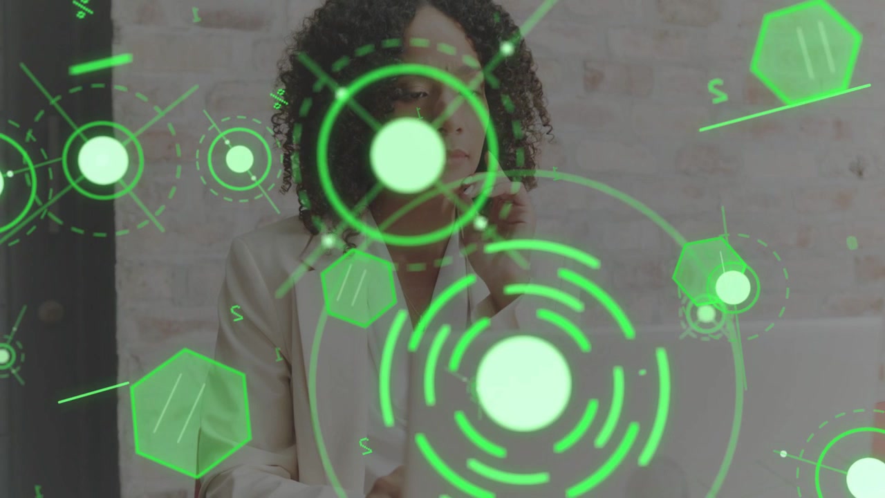 Woman typing on laptop, green HUD appearing, causing lean and ear touching while showing biz data