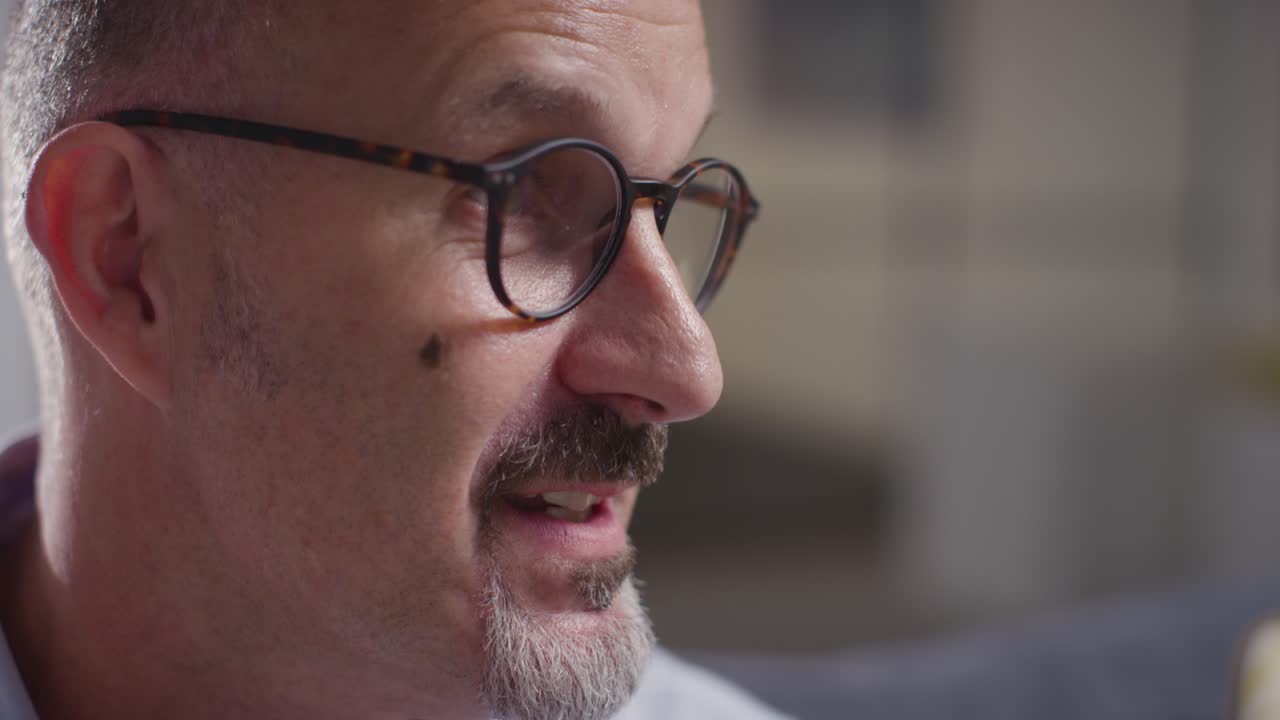 Mature Man Talking With Counsellor About General Or Mental Health Issue Shot In Real Time