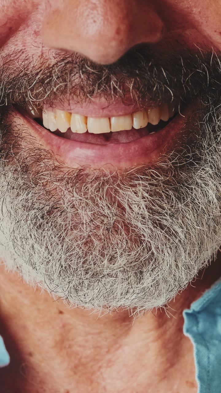 Close-up of a Smiling Man with a Gray Beard