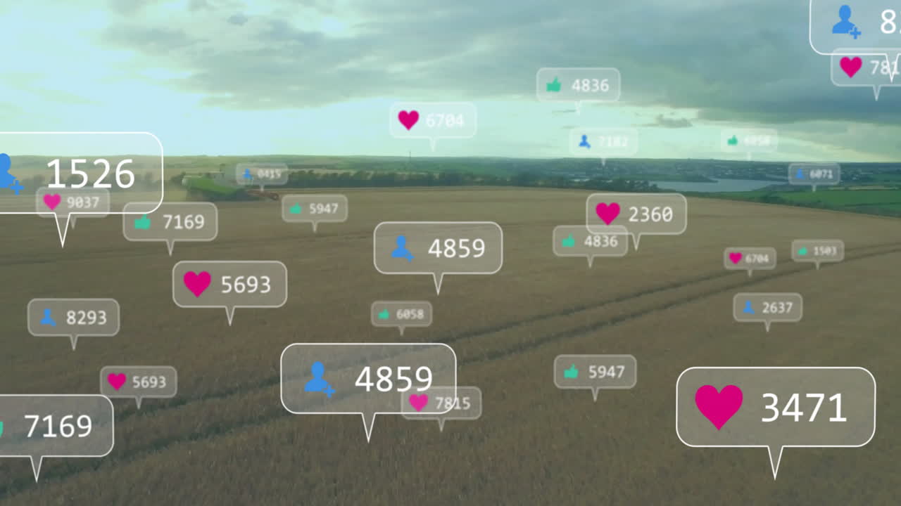 Golden wheat field stretching to horizon with social media bubbles floating above combine harvester