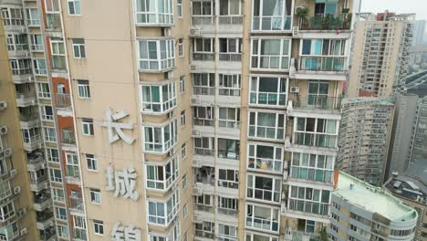 Descending-Drone-Shot-of-High-Rise-Residential-Building-in-Chengdu,-China