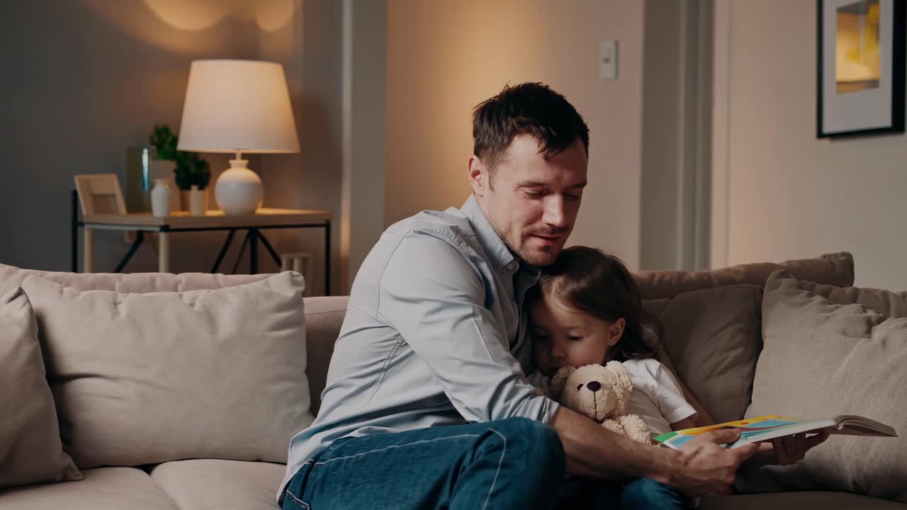 Father Reading Book to Daughter