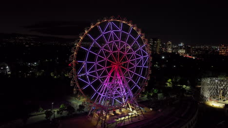 aerial view of ferris wheel in mexico city at night