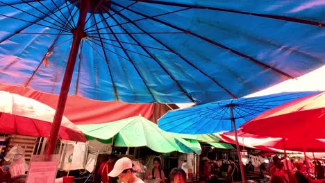 vendors selling fresh produce under colorful tents