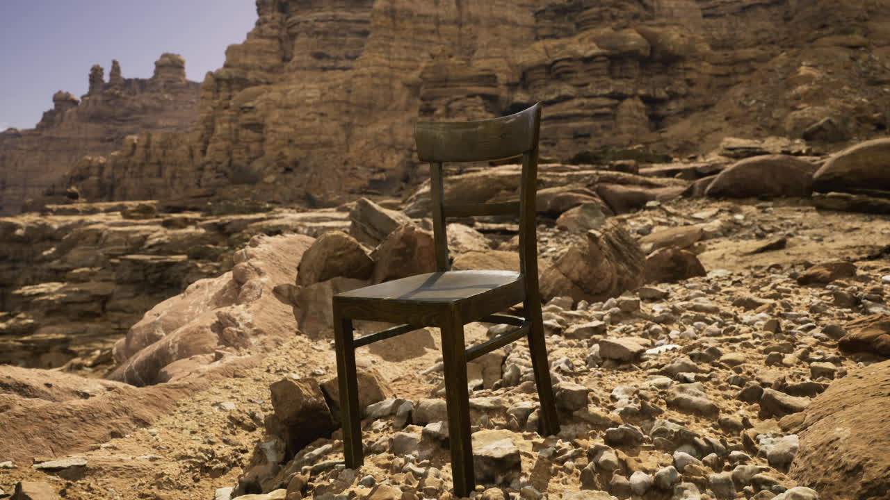 Chair placed alone among rocky terrain in a desert landscape