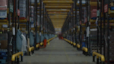 defocussed activity in warehouse pulls into focus, shot on r3d