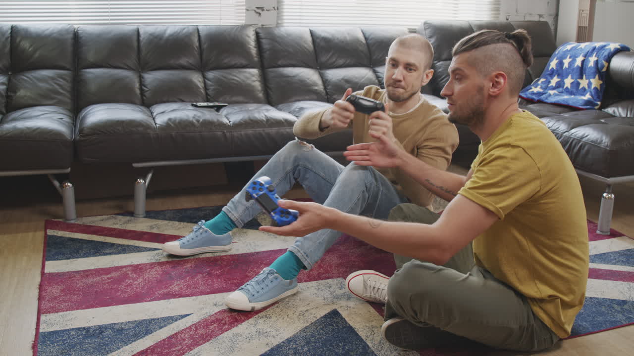 Young Men Playing Video Game at Home