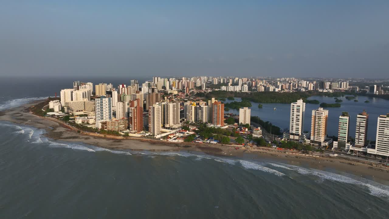 Tall buildings and beachfront towers of Sao Luis, Brazil stretch along the coastline, panoramic aerial backdrop