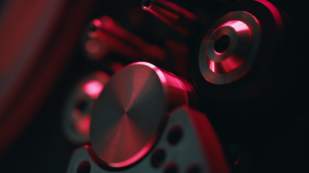 Macro view knobs reel-to-reel recorder in dark room. Closeup classic tape machine
