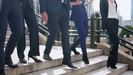 business professionals walking down outdoor stairs