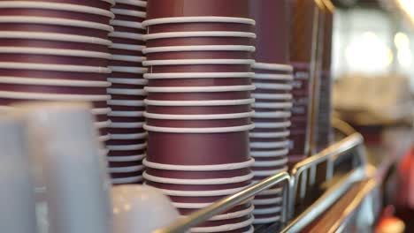 stack of coffee cups in a coffee shop