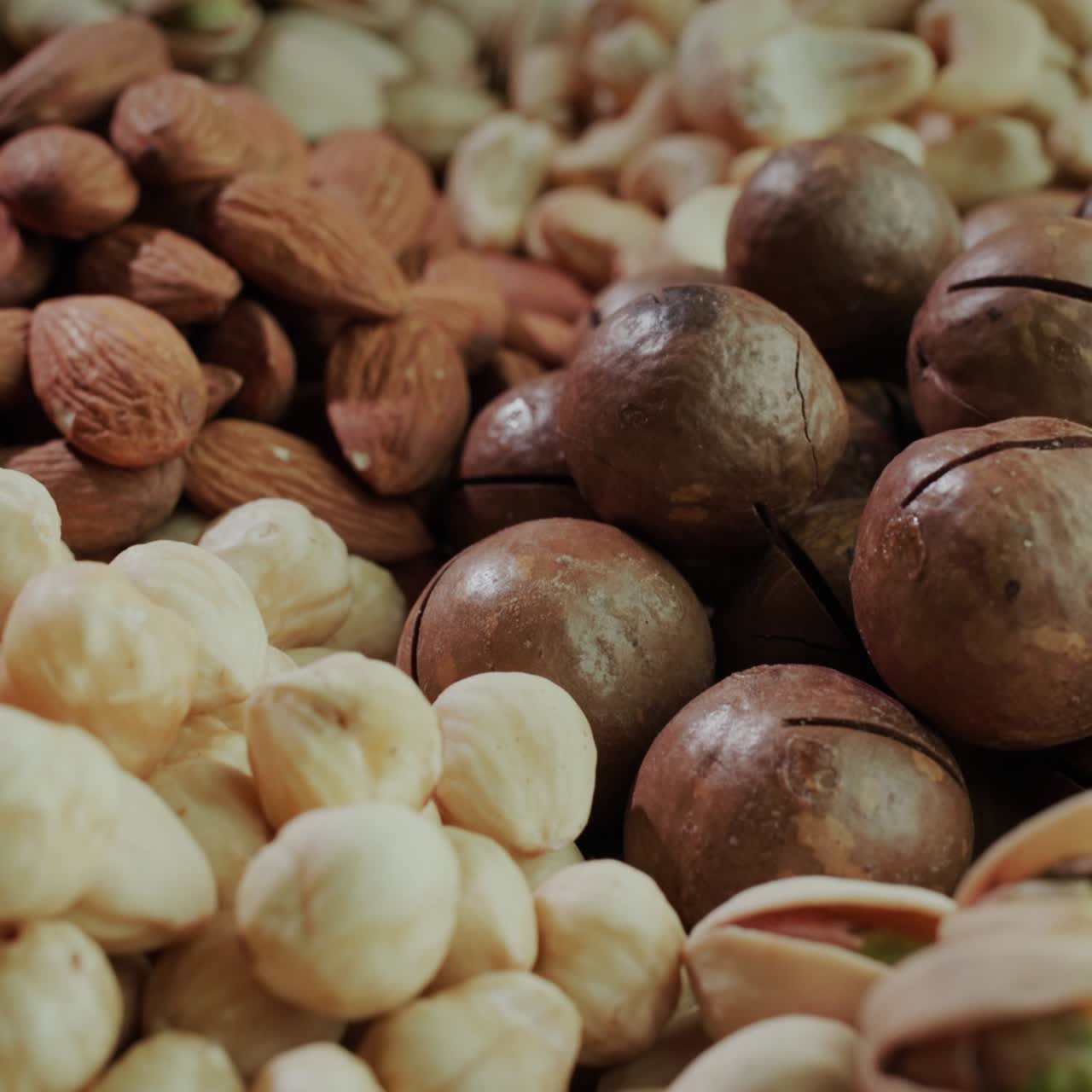 Handfuls of ready-to-eat nuts of different varieties
