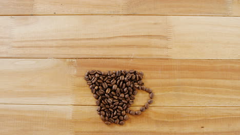 coffee beans forming shape of cup